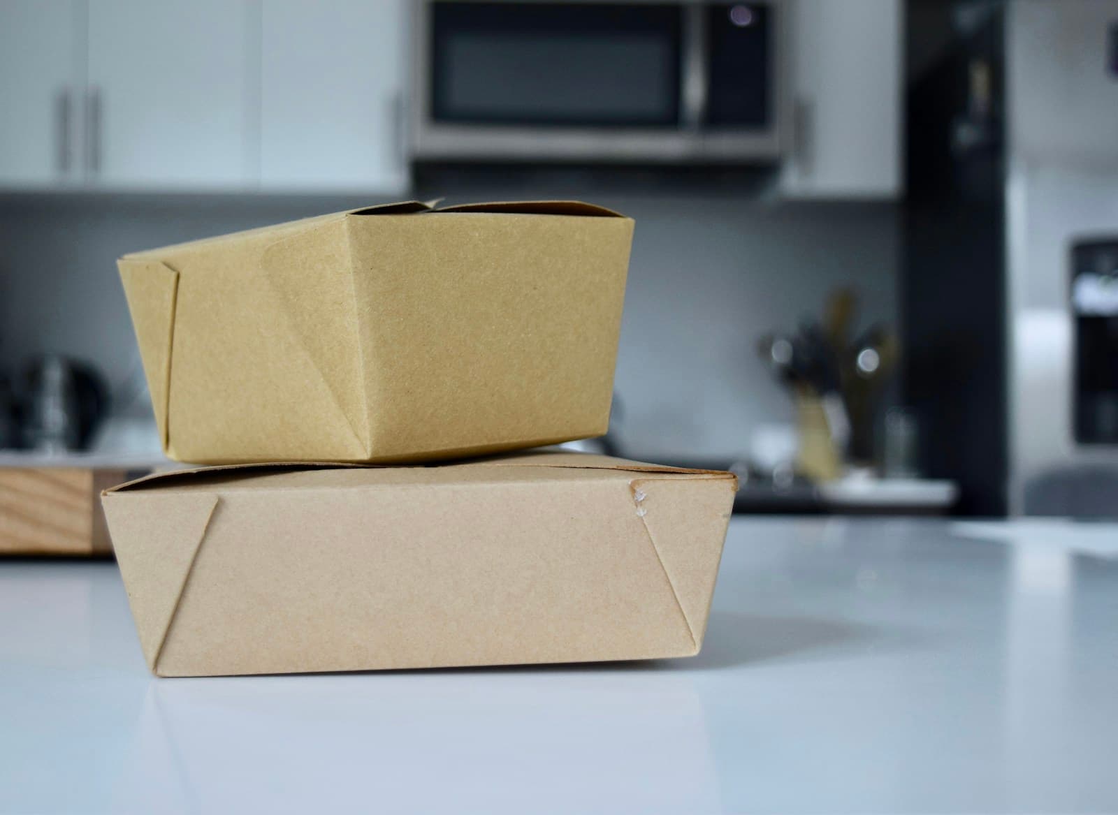 Brown cardboard takeout box on a white table